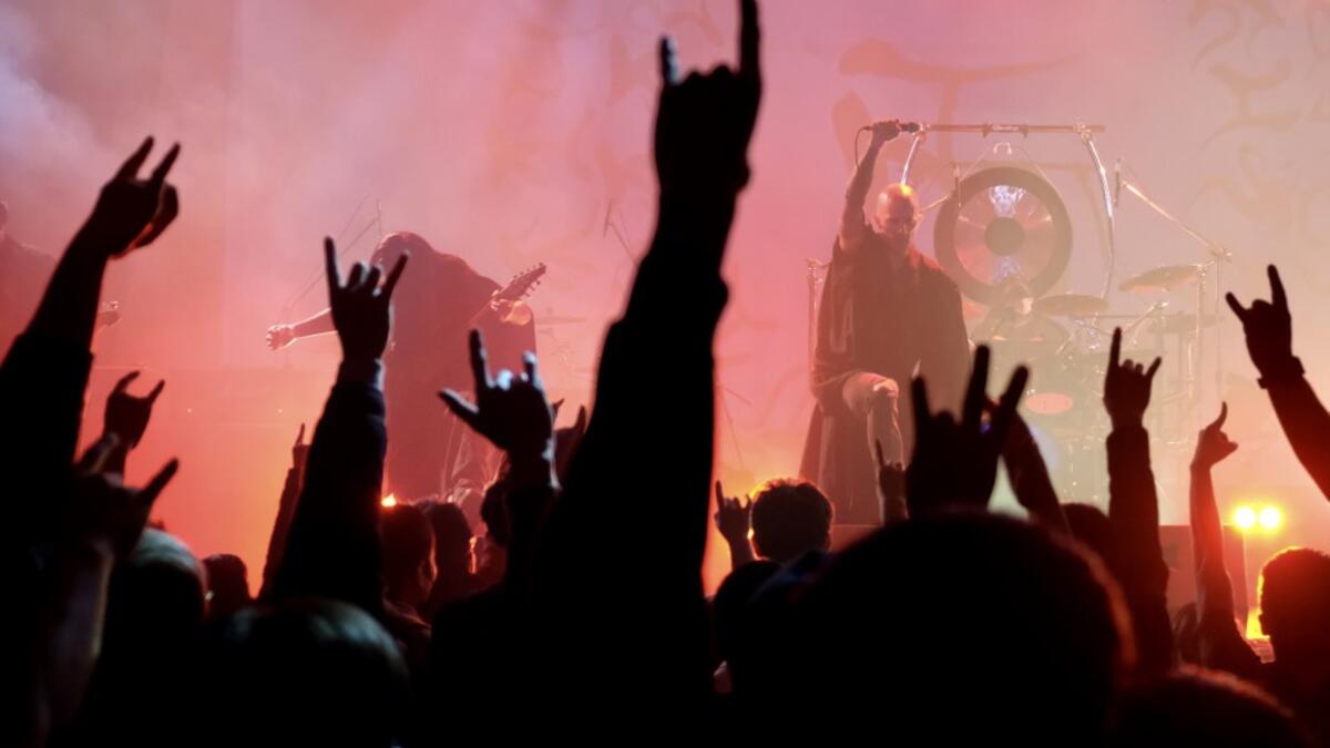This picture taken on January 2, 2021 shows Joe Henley (R), a leading vocalist of Taiwanese death metal band 'Dharma' performing during a concert in Taichung. Sam Yeh / AFP