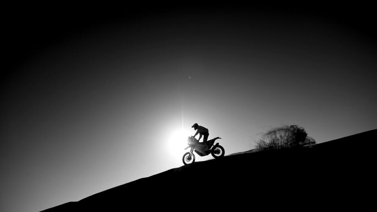 A biker takes part in Stage 2 of the Dakar Rally 2021 between Bisha and Wadi Ad-Dawasir in Saudi Arabia on January 4, 2021. FRANCK FIFE / AFP
