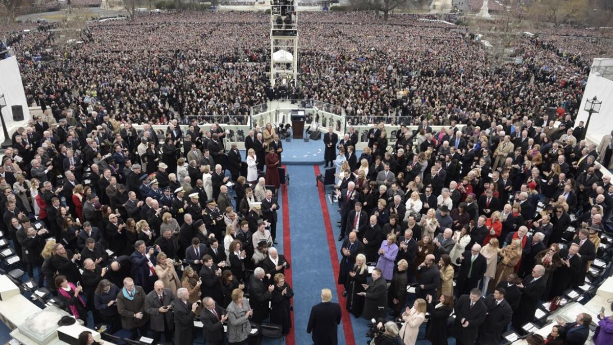 AFP presents a retrospective photo package of 60 pictures marking the 4-year presidency of President Trump. US President elect Donald Trump (C) arrives for the swearing-in ceremony on in front of the Capitol in Washington on January 20, 2017. Brendan SMIALOWSKI / AFP