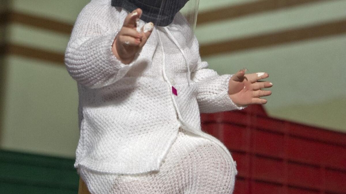View of a doll displayed for sale at the ¨Nino Uribe¨ traditional Mexican store in Mexico City on January 27, 2021. ¨Nino Uribe¨ sells representations of the Baby Jesus called Baby COVID to raise awareness on the preventive measures to take amid the COVID-19 coronavirus pandemic. CLAUDIO CRUZ / AFP