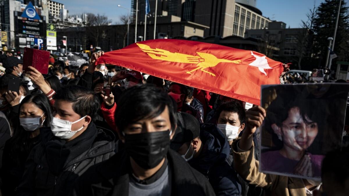 Myanmar activists chant slogans during a protest outside the United Nations University building in Tokyo on February 1, 2021, after Myanmar's military seized power in a bloodless coup and detaining democratically elected leader Aung San Suu Kyi as it imposed a one-year state of emergency. Philip FONG / AFP