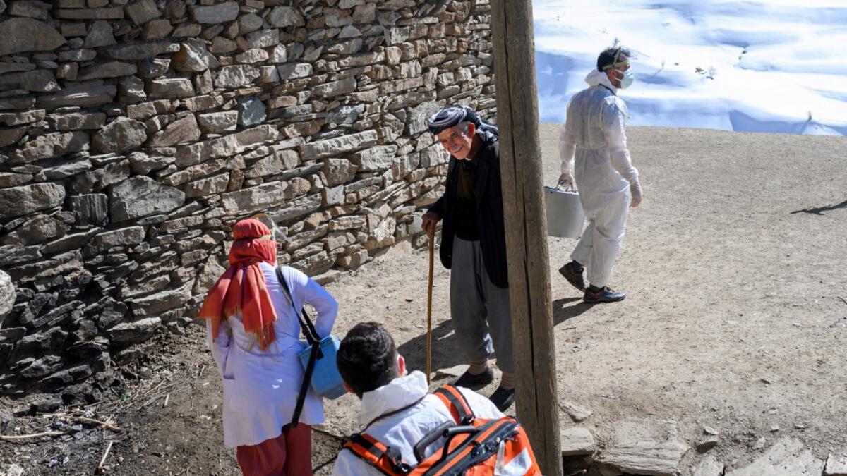 In this photograph taken on February 15, 2021, doctors and nurses from the Bahcesaray public hospital vaccination team, arrive at the village of Guneyyamac in eastern Turkey, as part of an expedition to vaccinate residents of 65 years old or above with Sinovac's CoronaVac Covid-19 vaccine. Turkey's population of more than 83 million is spread out across Europe and Asia and covers some seemingly impregnable terrain. The vaccination effort with China's CoronaVac jab kicked off with a bang in mid-January when