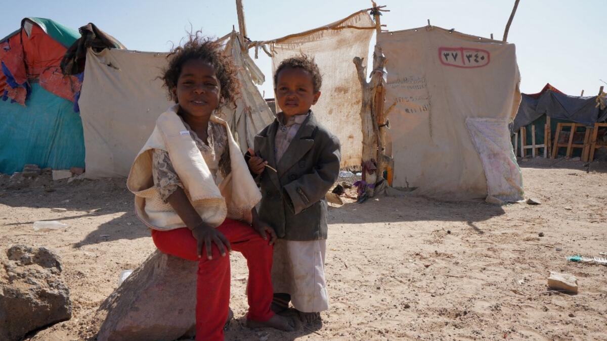 Yemeni children are pictured at the Jaw al-Naseem camp for internally displaced people on the outskirts of the northern city of Marib, on February 18, 2021 in the Saudi-backed Yemeni government's last northern bastion. Until early last year, life in Marib city was relatively peaceful despite the Yemen's civil war that erupted in 2014. The United Nations warned last week of a potential humanitarian disaster if the fight for Marib continues, saying it has put "millions of civilians at risk". More than 3.3 mil