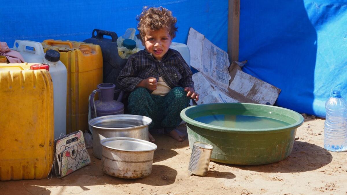 A Yemeni child sits at the Jaw al-Naseem camp for internally displaced people on the outskirts of the northern city of Marib, on February 18, 2021 in the Saudi-backed Yemeni government's last northern bastion. Until early last year, life in Marib city was relatively peaceful despite the Yemen's civil war that erupted in 2014. The United Nations warned last week of a potential humanitarian disaster if the fight for Marib continues, saying it has put "millions of civilians at risk". More than 3.3 million have