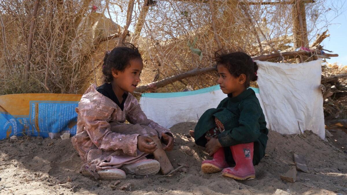 Yemeni girls sit at the Jaw al-Naseem camp for internally displaced people on the outskirts of the northern city of Marib, on February 18, 2021 in the Saudi-backed Yemeni government's last northern bastion. Until early last year, life in Marib city was relatively peaceful despite the Yemen's civil war that erupted in 2014. The United Nations warned last week of a potential humanitarian disaster if the fight for Marib continues, saying it has put "millions of civilians at risk". More than 3.3 million have be