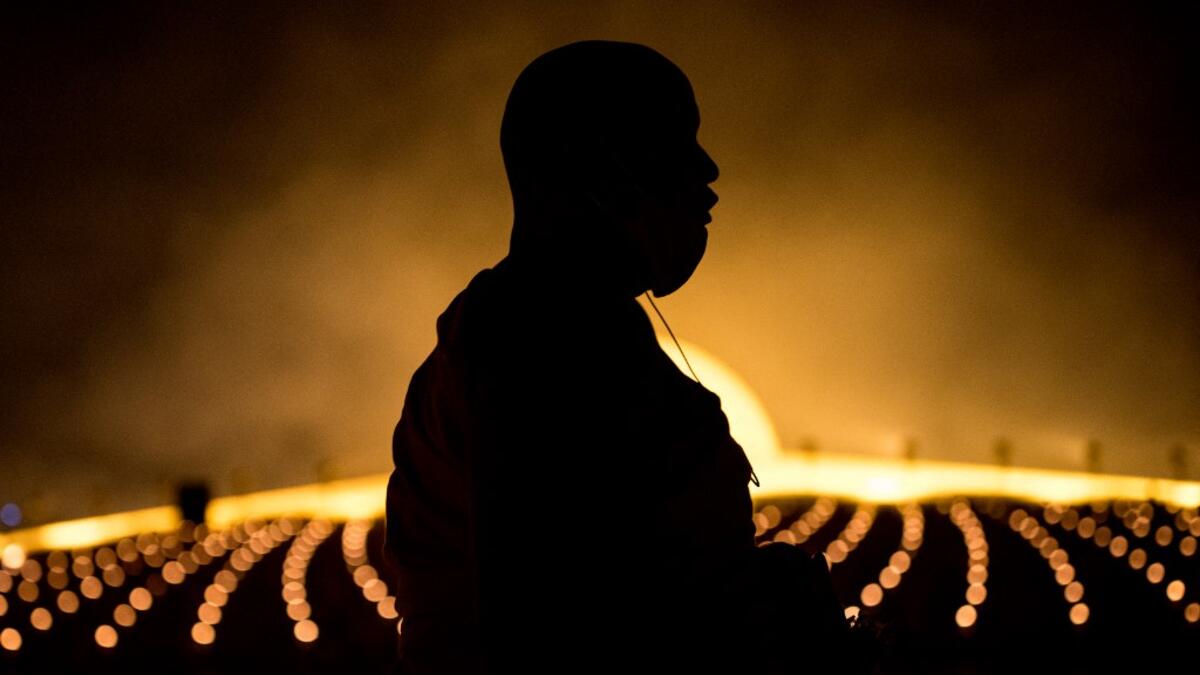 A Buddhist monk attends the Makha Bucha celebrations at Wat Dhammakaya, north of Bangkok on February 26, 2021. Jack TAYLOR / AFP