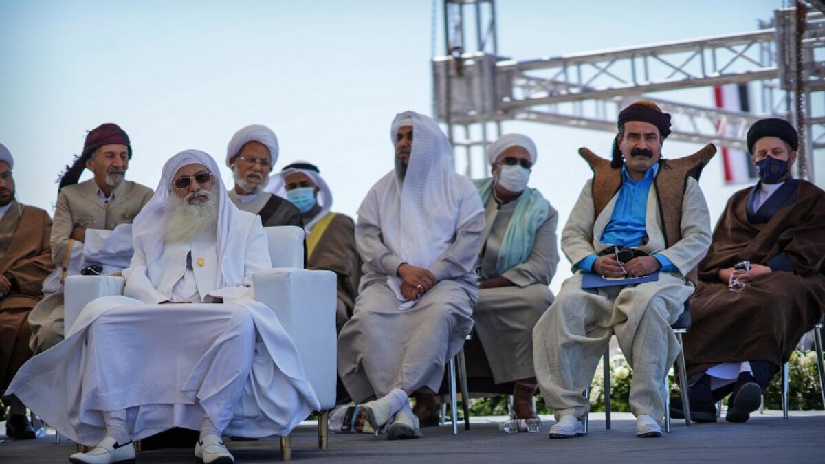 Chief of the Sabean Mandaean community, Sheikh Sattar Jabar Helou (L) and other dignitaries representing Iraq's religious