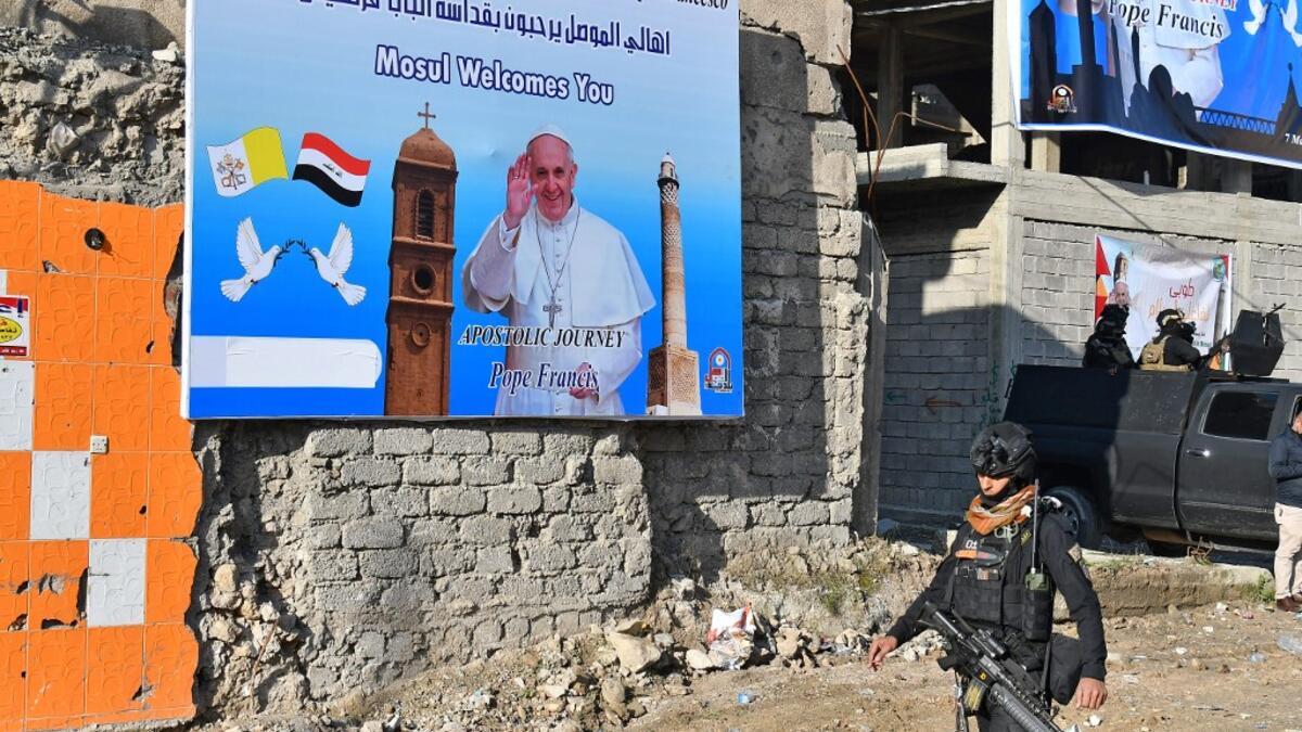 A member of the Iraqi security forces stands guard in the streets of the northern city of Mosul