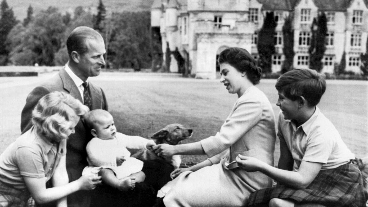 September 9, 1960 Britain's Queen Elizabeth II (2R), Britain's Prince Philip, Duke of Edinburgh (2L) and their three children Prince Charles (R), Princess Anne (L) and Prince Andrew (3L)