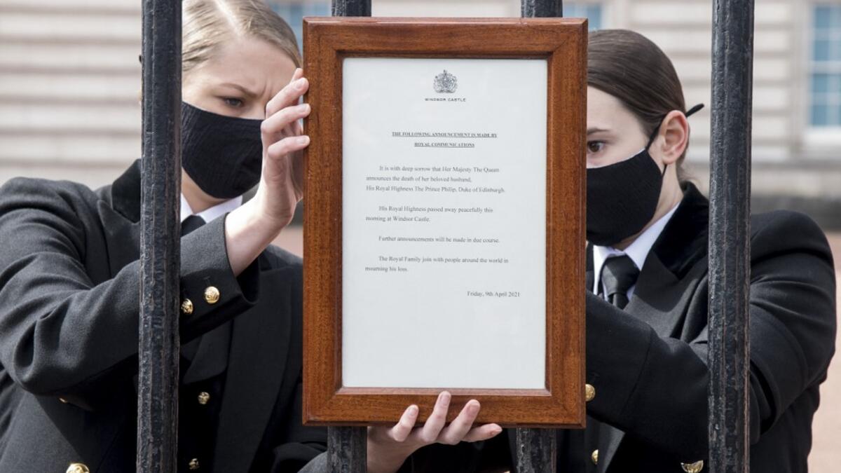 An official notice announcing the death of Britain's Prince Philip, Duke of Edinburgh is placed on the gates of Buckingham Palace