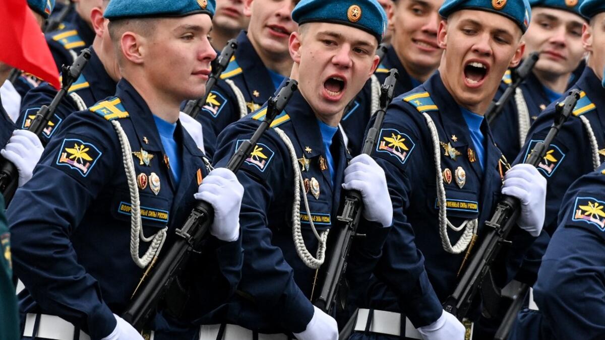Russian servicemen shout during the Victory Day military parade at Red Square in Moscow on May 9, 2021. Russia celebrates the 76th anniversary of the victory over Nazi Germany during World War II.