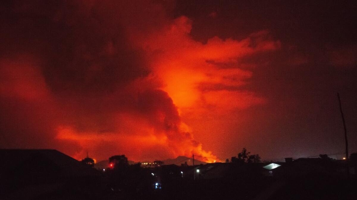 This general view taken on May 22, 2021 in Goma in the East of the Democratic Republic of Congo shows flame spewing from the Nyiragongo volcano. The famous Nyiragongo volcano, near the city of Goma, in the east of the Democratic Republic of the Congo (DRC), suddenly became active on Saturday evening, an AFP correspondent noted. Strong emanations of glowing light coming out of the crater were visible from Goma, while a smell of sulfur was perceptible in the city