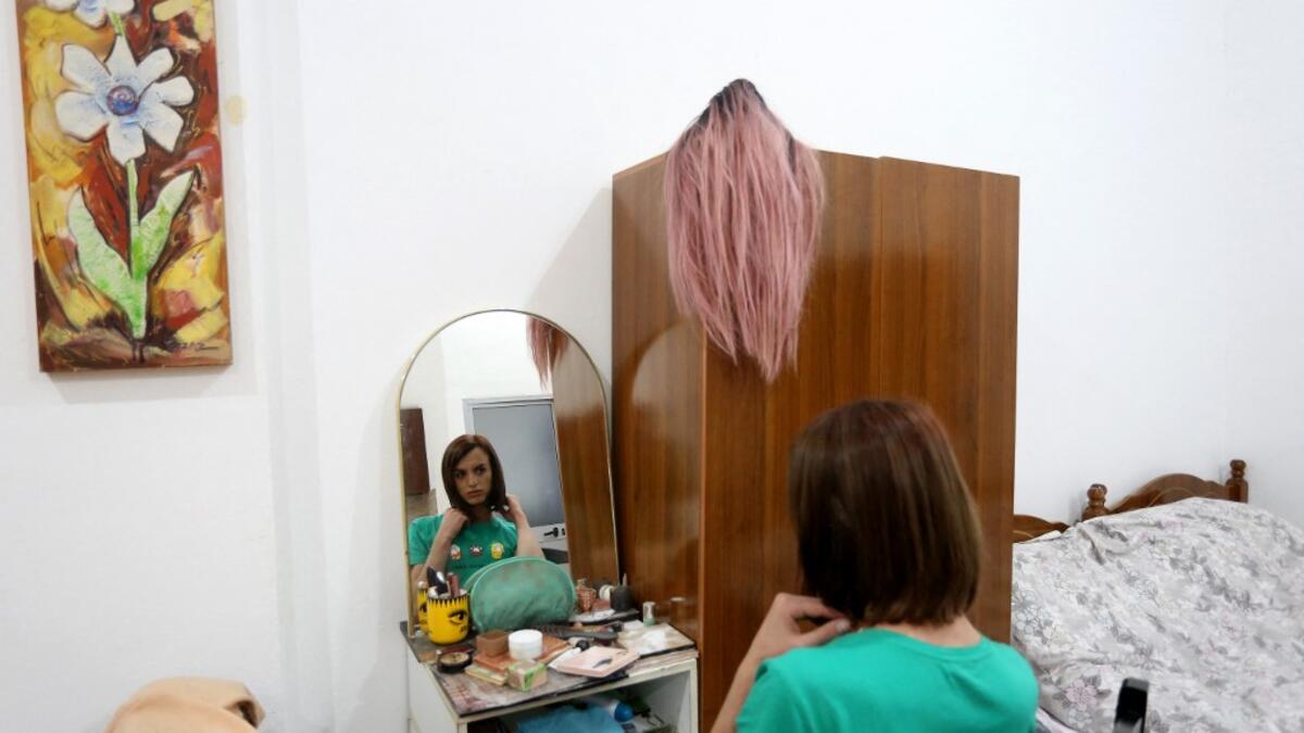 Albanian transgender Luana, puts her makeup on, in her house in Tirana