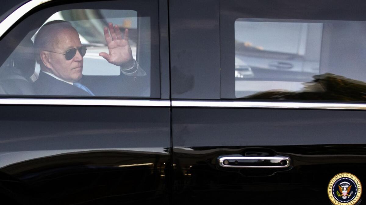 US president Joe Biden waves as he leaves for the airport after his press conference at the end of the US-Russia summit in Geneva