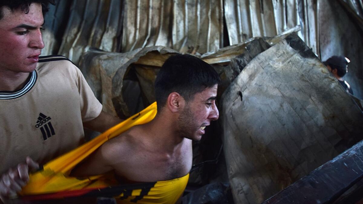 Iraqis Mourn Victims in Covid-19 Facility Hospital Fire