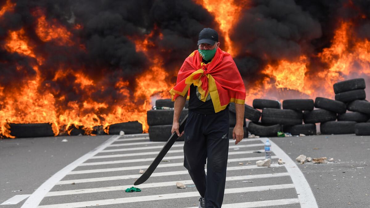 The new head of the Serbian Orthodox Church in Montenegro was inaugurated, arriving by helicopter under the protection of police who dispersed protesters with tear gas. The decision to anoint Bishop Joanikije as the new Metropolitan of Montenegro at the historic monastery of Cetinje has aggravated ethnic tension in the tiny Balkan state.