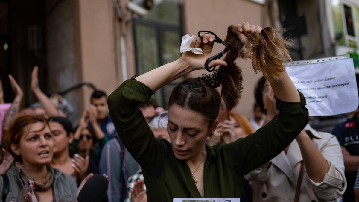 Mahsa Amini, 22, was on a visit with her family to the Iranian capital Tehran, when she was detained on September 13, 2022, by the police unit responsible for enforcing Iran's strict dress code for women, including the wearing of the headscarf in public. (Photo by Yasin AKGUL / AFP) Mahsa Amini