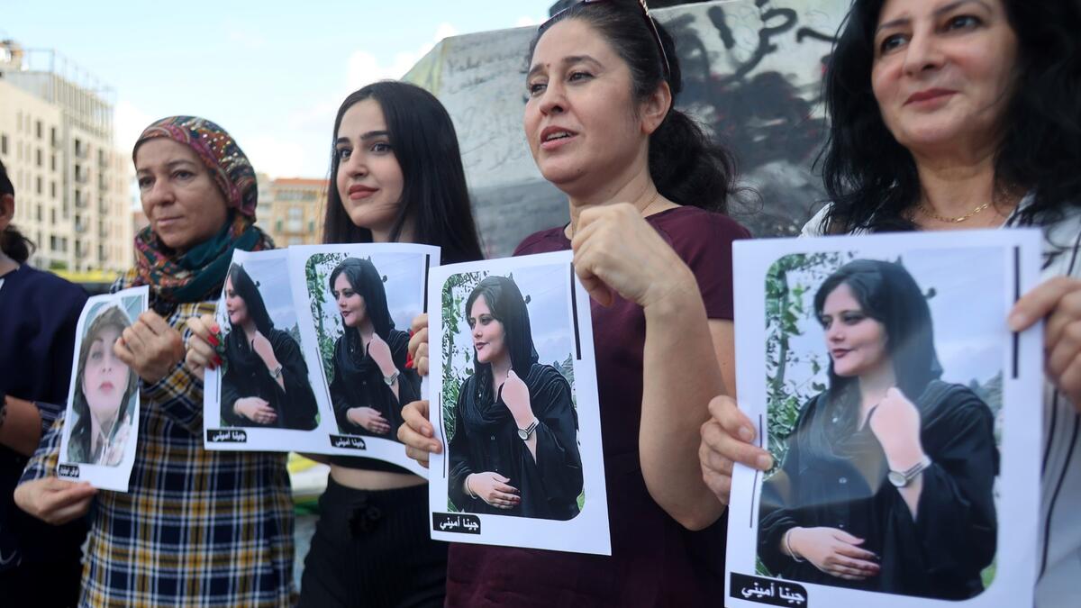 Kurdish and Lebanese women take part in a rally in the downtown district of the capital Beirut on Spetember 21, 2022, days after the Iranian authorities announced the death of Mahsa Amini, who had been held in the capital Tehran for allegedly wearing a hijab headscarf in an "improper" way. (Photo by ANWAR AMRO / AFP) Mahsa Amini
