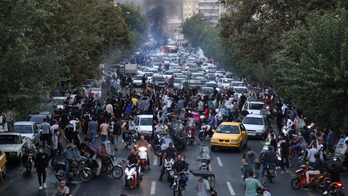In the fifth night of street rallies, police used tear gas and made arrests to disperse crowds of up to 1,000 people, the official IRNA news agency said. (Photo by AFP) Mahsa Amini