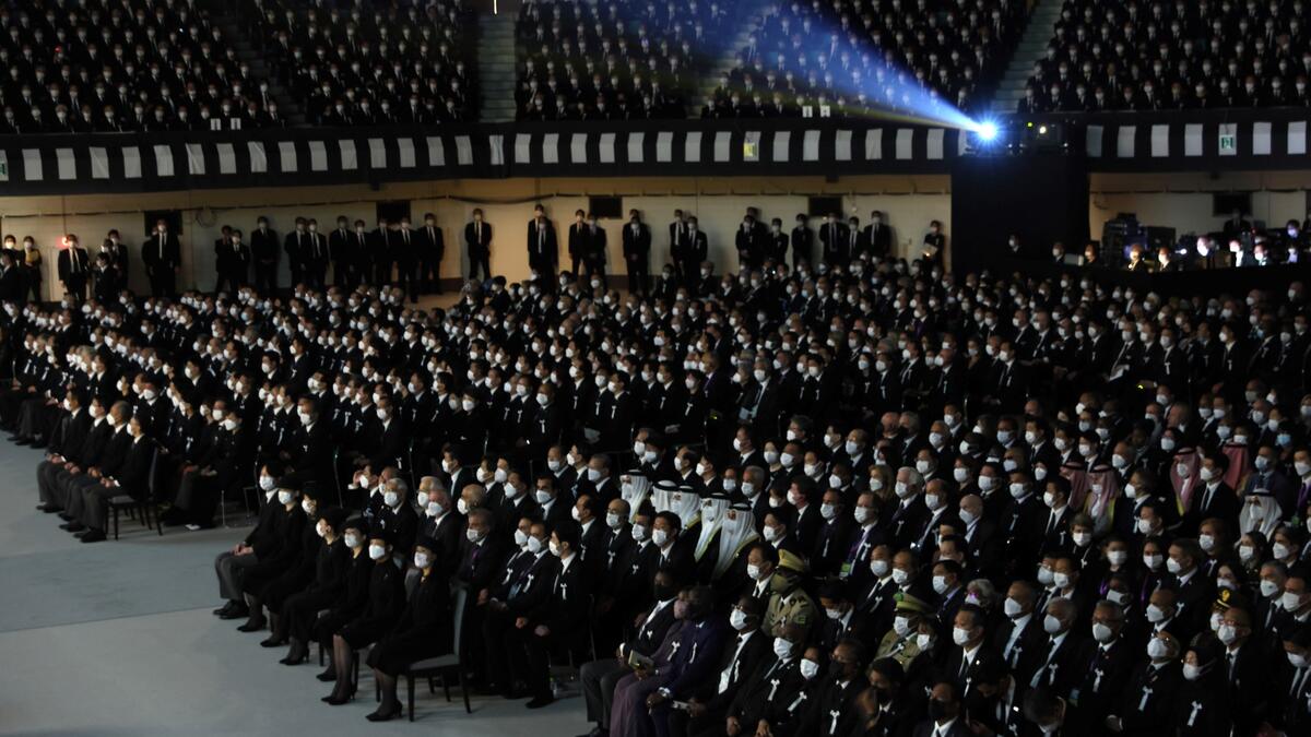 Guests attend the state funeral for Japan's former prime minister Shinzo Abe in the Nippon Budokan in Tokyo on September 27, 2022. (Photo by LEAH MILLIS / POOL / AFP) Shinzo Abe