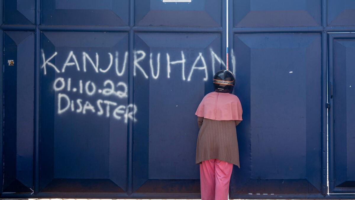 Elite Indonesian police officers were under investigation on October 4 over a stadium stampede that killed 125 people including dozens of children in one of the deadliest disasters in football history. (Photo by JUNI KRISWANTO / AFP) Indonesia's football stadium