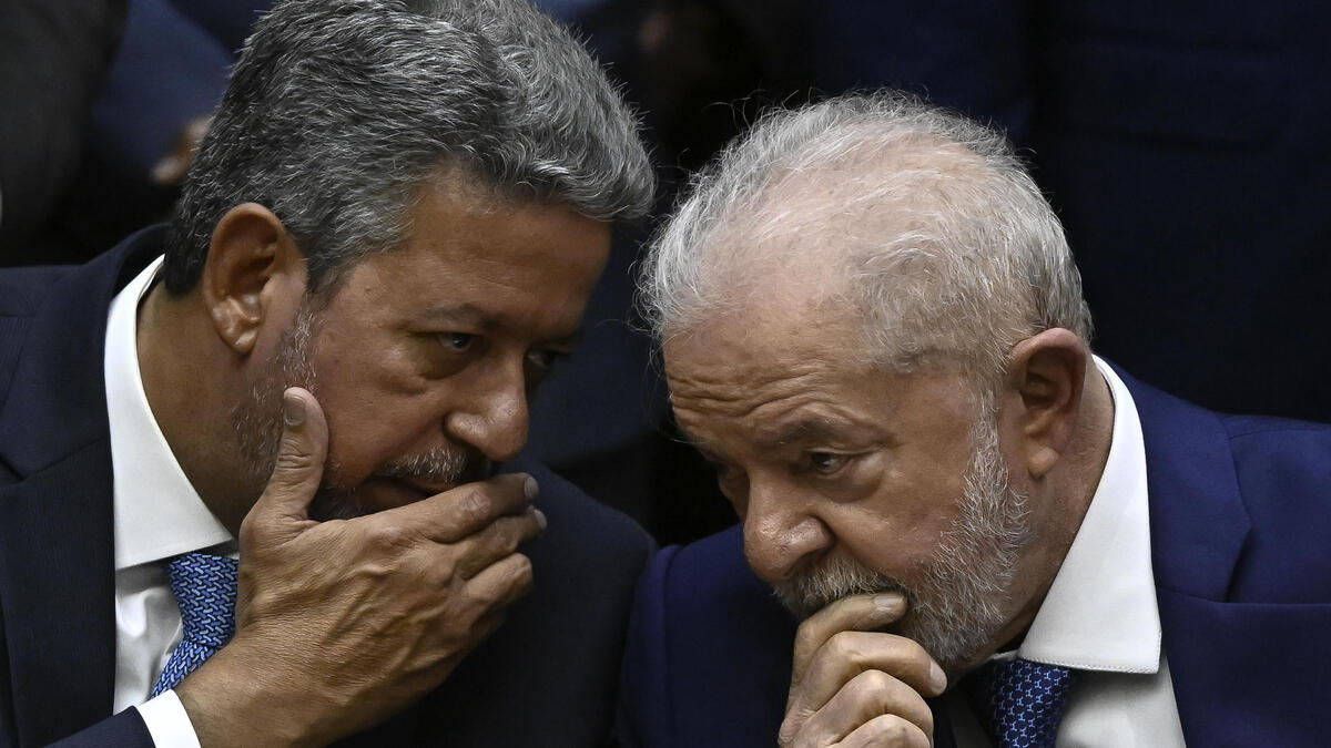 Brazil's new President Luiz Inacio Lula da Silva (R) talks with the President of the Chamber of Deputies Arthur Lira (L) during his inauguration ceremony at the National Congress in Brasilia, on January 1, 2023. Lula da Silva, a 77-year-old leftist who already served as president of Brazil from 2003 to 2010, takes office for the third time with a grand inauguration in Brasilia. (Photo by MAURO PIMENTEL / AFP) Brazil's new President Luiz Inacio Lula da Silva (R) talks with the President of the Chamber of Deputies Arthur Lira (L)