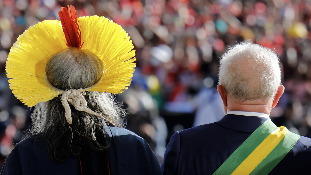 Brazil's new President Luiz Inacio Lula da Silva (R) stands with indigenous Brazilian leader and environmentalist Raoni Metuktire, known as Chief Raoni, after receiving the presidential sash from him and other community representatives, at Planalto Palace after his inauguration ceremony at the National Congress, in Brasilia, on January 1, 2023. Lula da Silva, a 77-year-old leftist who already served as president of Brazil from 2003 to 2010, takes office for the third time with a grand inauguration in Brasilia. (Photo by Sergio Lima / AFP) de Silva inauguration