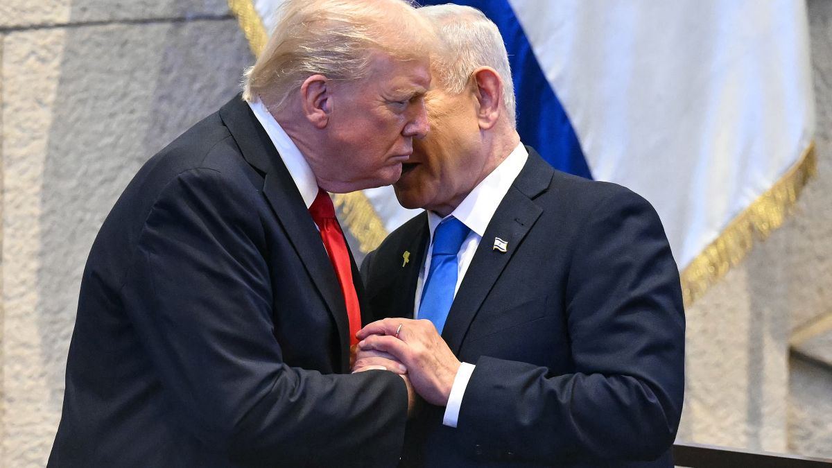 Israeli Prime Minister Benjamin Netanyahu whispers to US President Donald Trump (L) at the Israeli parliament, the Knesset, in Jerusalem on October 13, 2025. Hamas handed over the 20 surviving Israeli hostages on October 13 under a ceasefire agreement, as the US President and other world leaders geared up for a summit on Gaza. The releases are part of a ceasefire agreement brokered by the US President, with Israel due in return to free nearly 2,000 detainees held in its jails in exchange. (Photo by SAUL LOEB / POOL / AFP) Trump Reportedly ready to "Punish Netanyahu severely" if Gaza agreement collapses