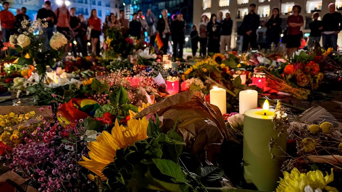 Candles are lit among flowers in commemoration of the victims of the attack.