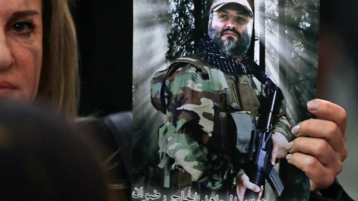 A Lebanese woman carries a portrait of of slain Hezbollah military leader Imad Mughnieh as she attends a gathering for a televised speech held by the Shiite party in the capital Beirut, commemorating the party's killed leaders, on February 16, 2018. 
(JOSEPH EID / AFP)