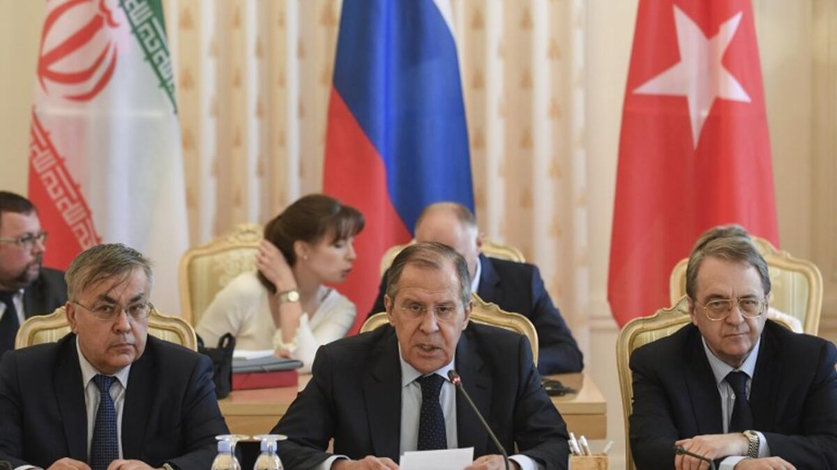 Russian Foreign Minister Sergei Lavrov speaks during a meeting with his Turkish and Iranian counterparts in Moscow on April 28, 2018. Alexander NEMENOV / AFP