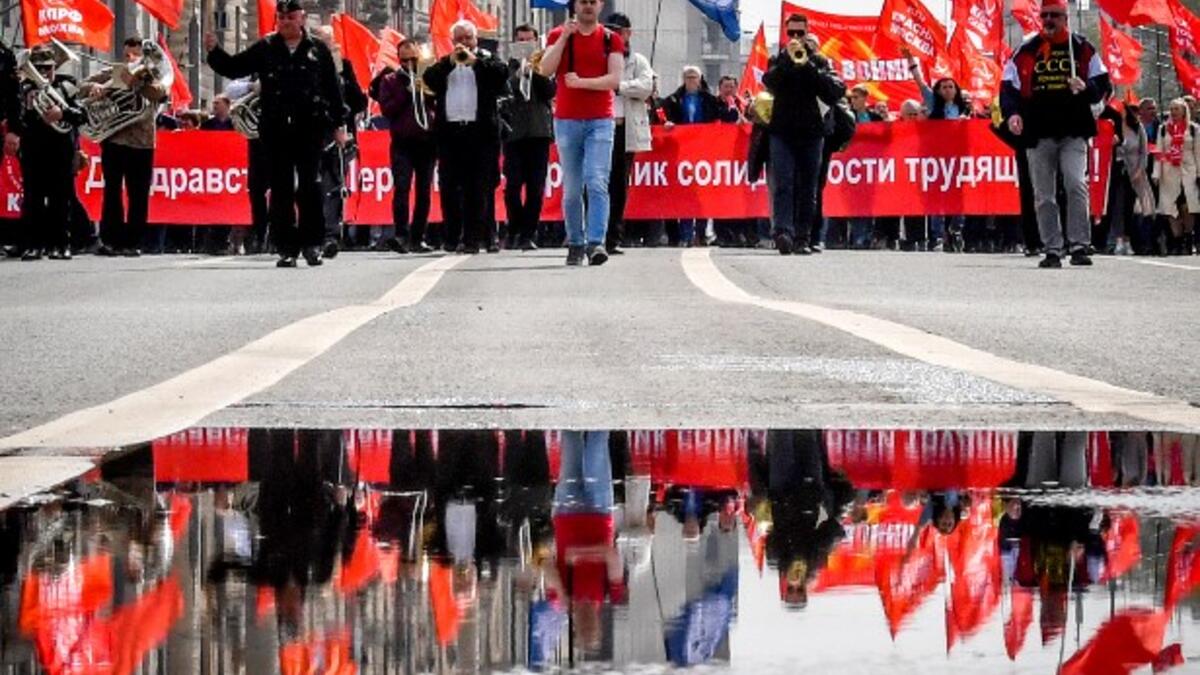 Activists and supporters of Russia's left-wing parties and movements march during a May Day rally in downtown Moscow on May 1, 2018 / AFP