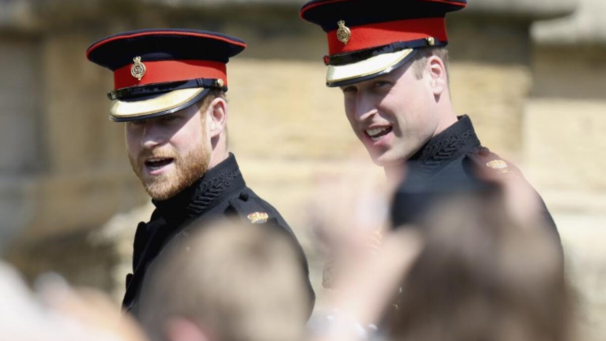 Britain's Prince Harry, Duke of Sussex (L) and Prince Harry's brother and best man Prince William, Duke of Cambridge arrive for the wedding ceremony of Britain's Prince Harry, Duke of Sussex and US actress Meghan Markle at St George's Chapel, Windsor Castle, in Windsor, on May 19, 2018. 
Chris Jackson/ AFP