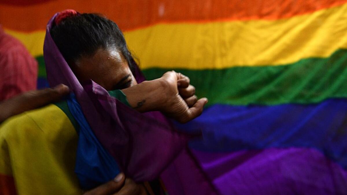 An Indian member and supporters of the lesbian, gay, bisexual, transgender (LGBT) community cries as she celebrates the Supreme Court decision to strike down a colonial-era ban on gay sex, in Chennai on September 6, 2018. 
ARUN SANKAR / AFP
