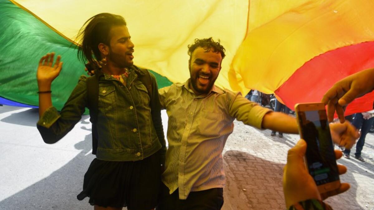 Indian members and supporters of the lesbian, gay, bisexual, transgender (LGBT) community celebrate the Supreme Court decision to strike down a colonial-era ban on gay sex, in Mumbai on September 6, 2018.
INDRANIL MUKHERJEE / AFP