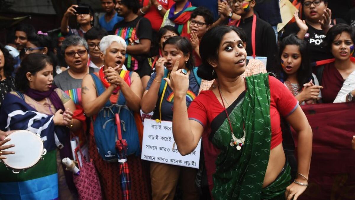 Indian members and supporters of the lesbian, gay, bisexual, transgender (LGBT) community celebrate the Supreme Court decision to strike down a colonial-era ban on gay sex, in Kolkata on September 6, 2018. 
Dibyangshu SARKAR / AFP