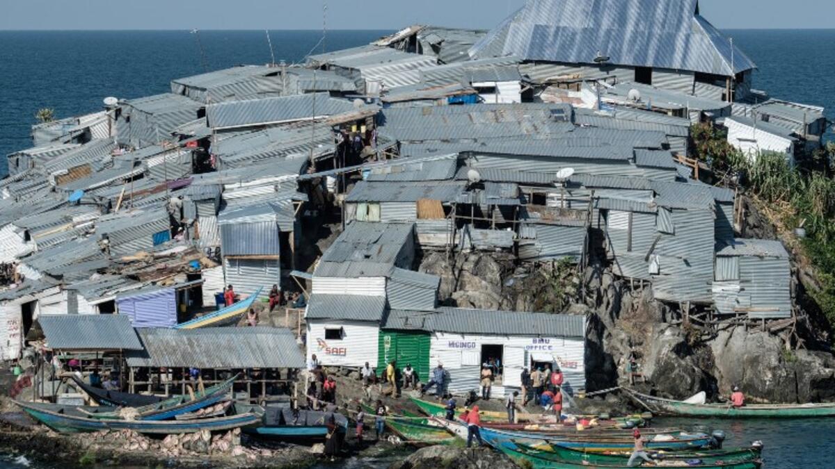 A picture taken on October 5, 2018, shows a general view of Migingo island which is densely populated by residents fishing mainly for Nile perch in Lake Victoria on the border of Uganda and Kenya. 
Yasuyoshi CHIBA / AFP