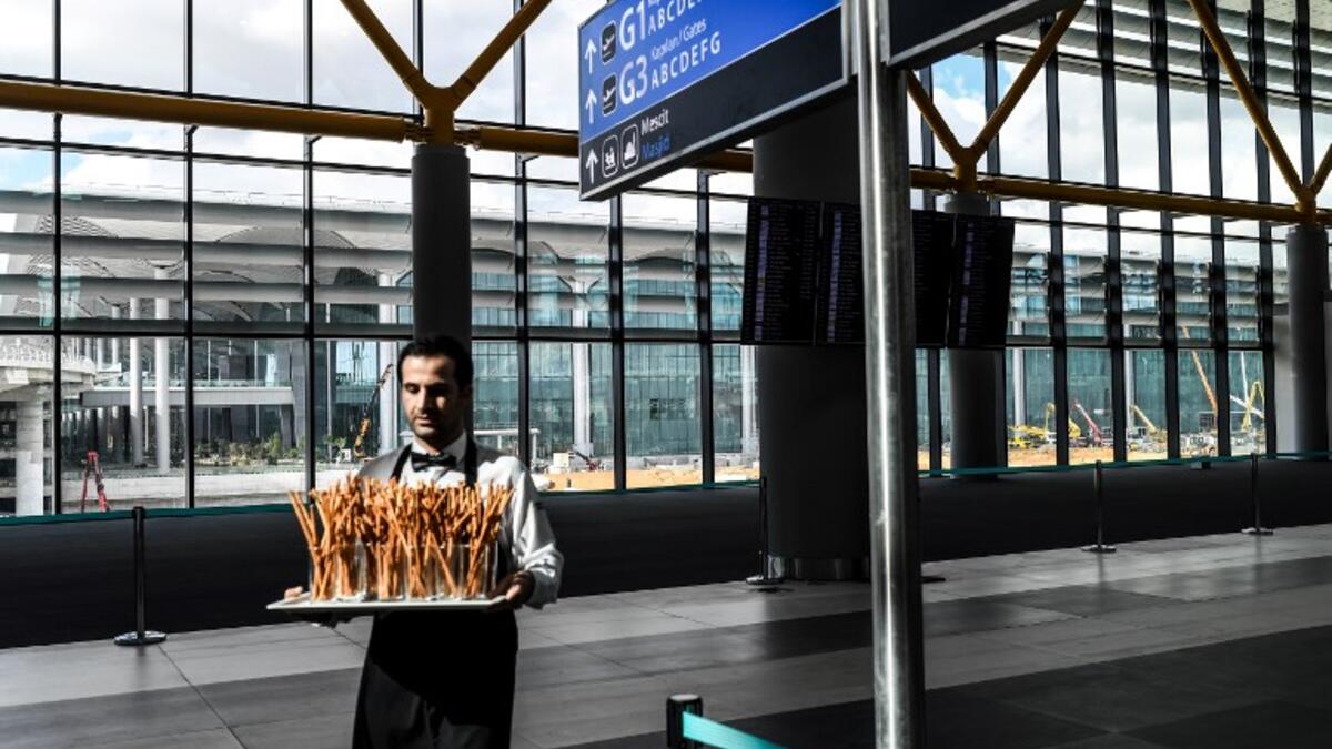 People attend the opening ceremony of Istanbul's new international airport, in the Arnavutkoy district, on the European side of Istanbul on October 29, 2018. Turkish 
BULENT KILIC / AF