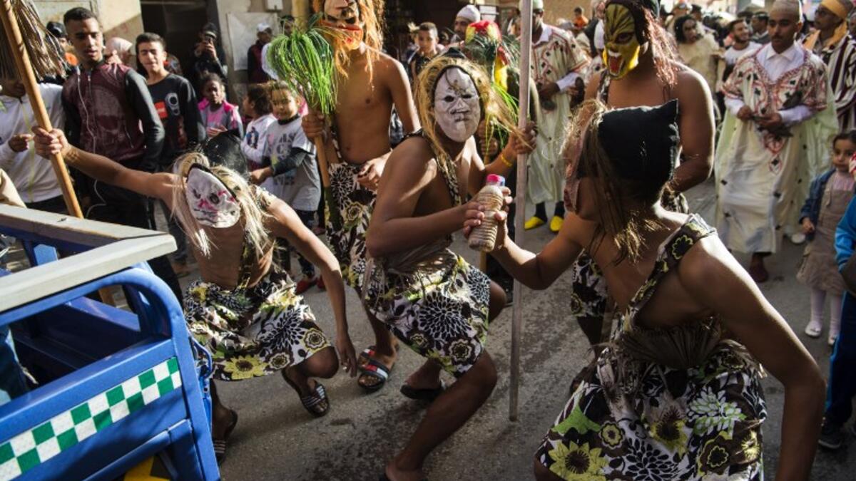 Young Moroccans take part in the Boujloud festival, a popular celebration also known as the 'Moroccan Halloween' in the Sidi Moussa district of Sale near Rabat, on October 27, 2018. 
FADEL SENNA / AFP