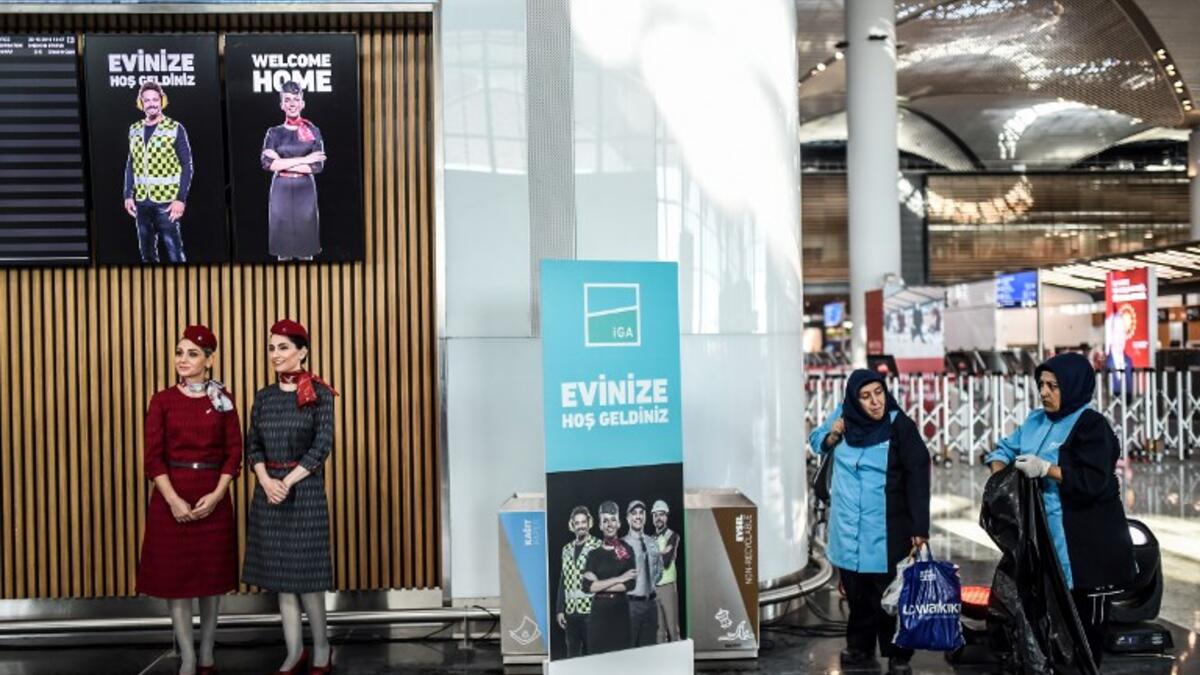 Hostes and workers are seen during the opening ceremony of the new airport building during a opening ceremony of Istanbul's third airport, the Istanbul New Airport, in the Arnavutkoy district on the European side of Istanbul on October 29, 2018. 
BULENT KILIC / AFP