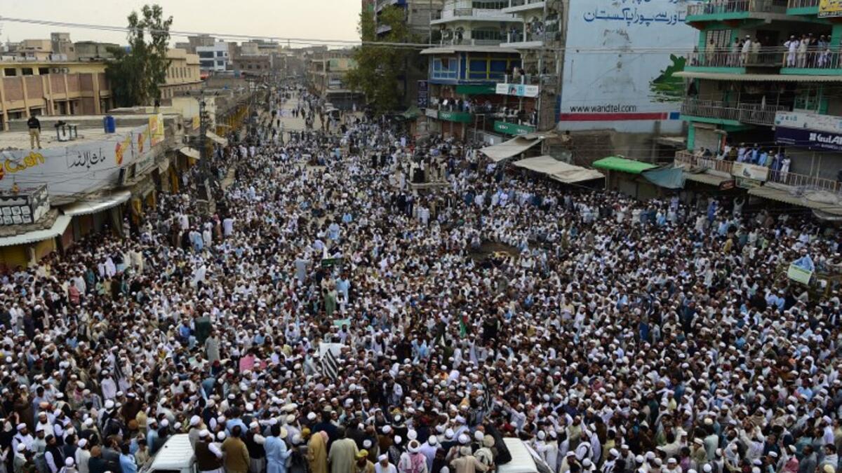 Supporters of Pakistan's religious hardline party Jamiat Ulema Islam (JUI) march during a protest rally following the Supreme Court's decision to acquit Pakistani Christian woman. (ABDUL MAJEED / AFP)