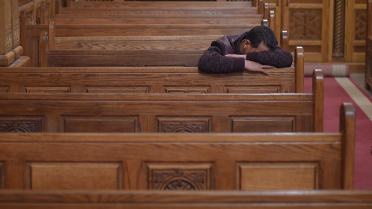 A Coptic Christian man mourns victims killed in an attack a day earlier, during an early morning ceremony at the Prince Tadros church in Egypt's southern Minya province, on November 3, 2018. 
MOHAMED EL-SHAHED / AFP