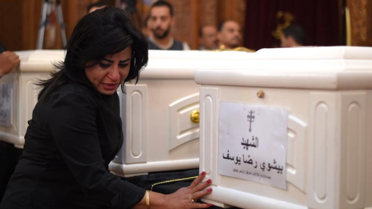 A Coptic Christian woman mourns victims killed in an attack a day earlier, during an early morning ceremony at the Prince Tadros church in Egypt's southern Minya province, on November 3, 2018.  
MOHAMED EL-SHAHED / AFP