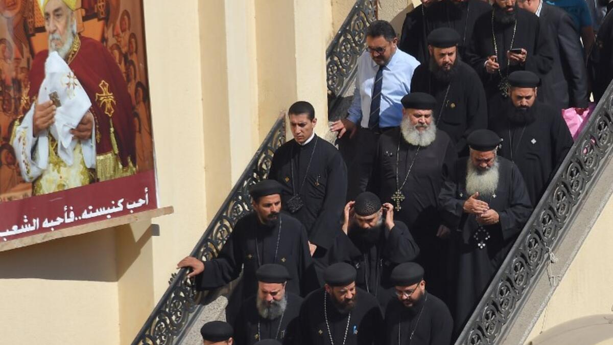 Coptic Christian priets leave the Prince Tadros church in Egypt's southern Minya province, following a morning ceremony for victims killed in an attack a day earlier, on November 3, 2018. 
MOHAMED EL-SHAHED / AFP