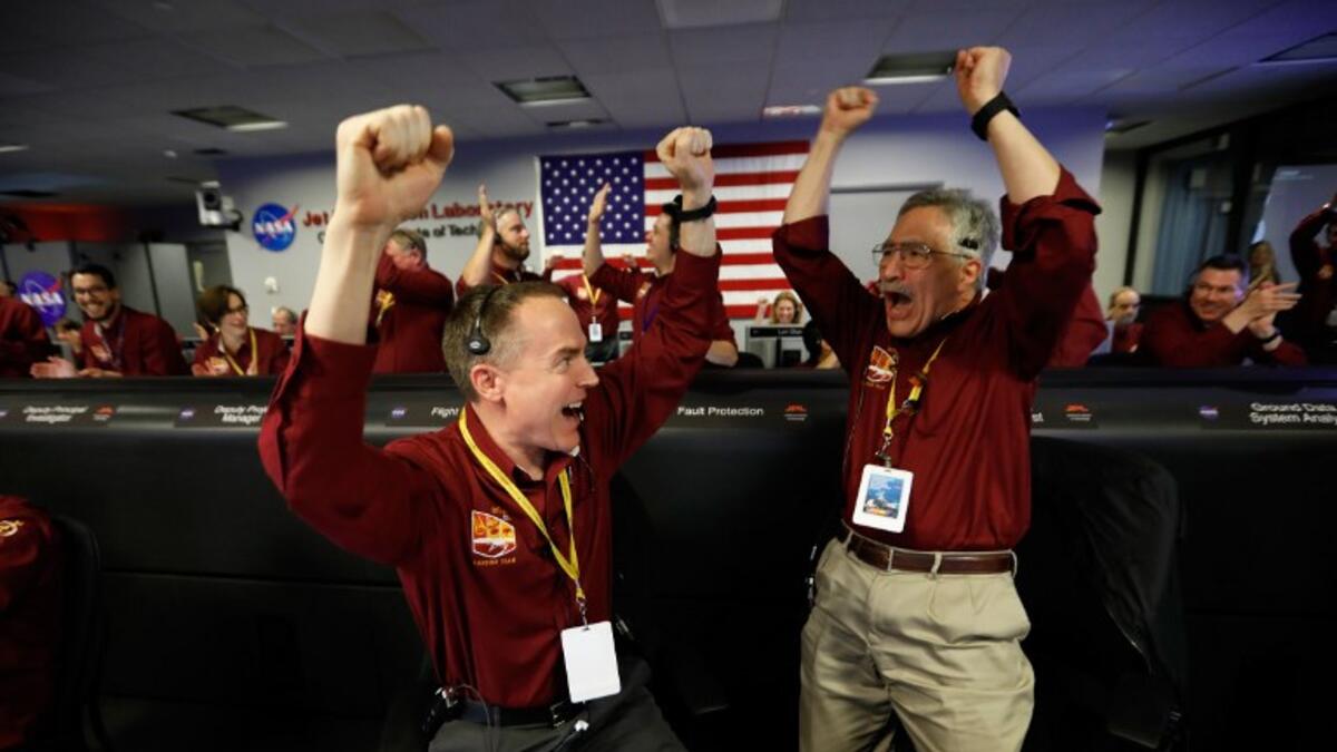 Cheers and applause erupted at NASA's Jet Propulsion Laboratory as a $993 million unmanned lander, called InSight, touched down on the Red Planet and managed to send back its first picture.
Al SEIB / POOL / AFP