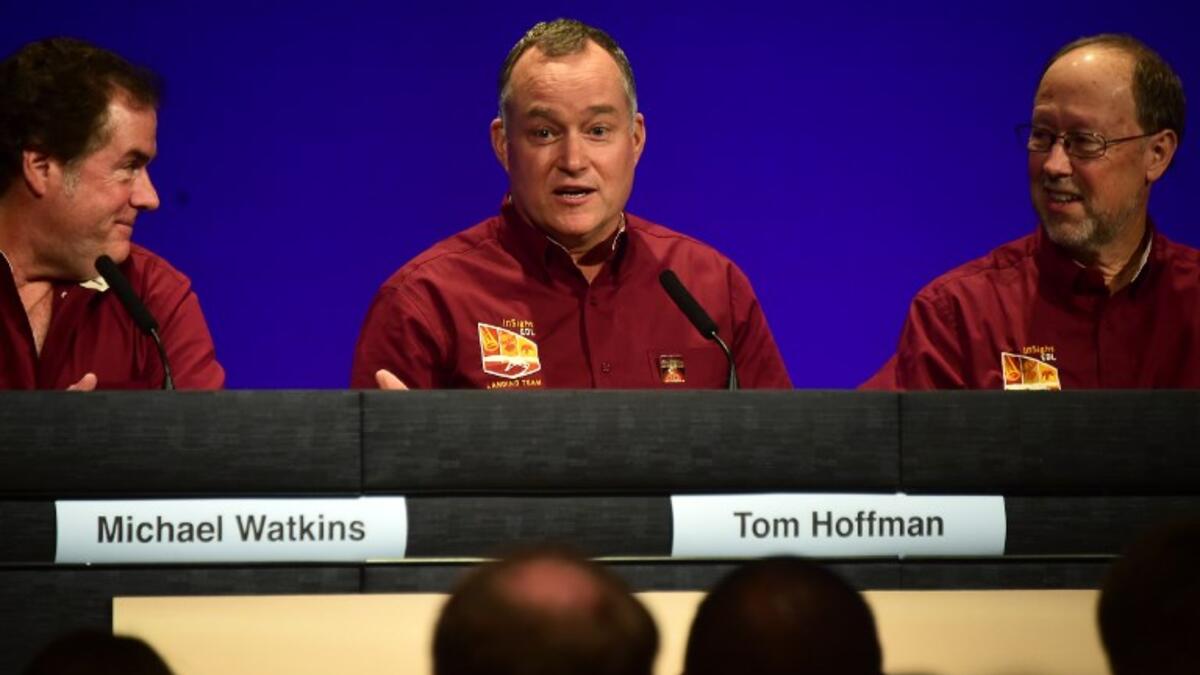 NASA engineer and project manager Tom Hoffman (C), flanked by Michael Watkins (L) and Bruce Banerdt (R) speak during press conference after the successful landing.
CREDITFREDERIC J. BROWN / AFP