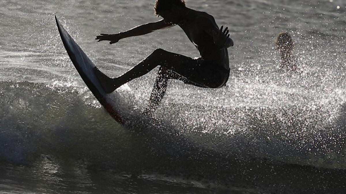 A surfer enjoys the waves at Las Baulas National Marine Park, Playa Grande, Costa Rica on December 10, 2018. David GANNON / AFP
