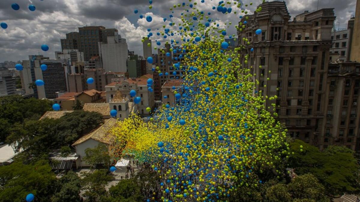Thousands of biodegradable balloons are released by members of the Chamber of Commerce to celebrate New Year in Sao Paulo, Brazil, on December 28, 2017. 
Miguel SCHINCARIOL / AFP