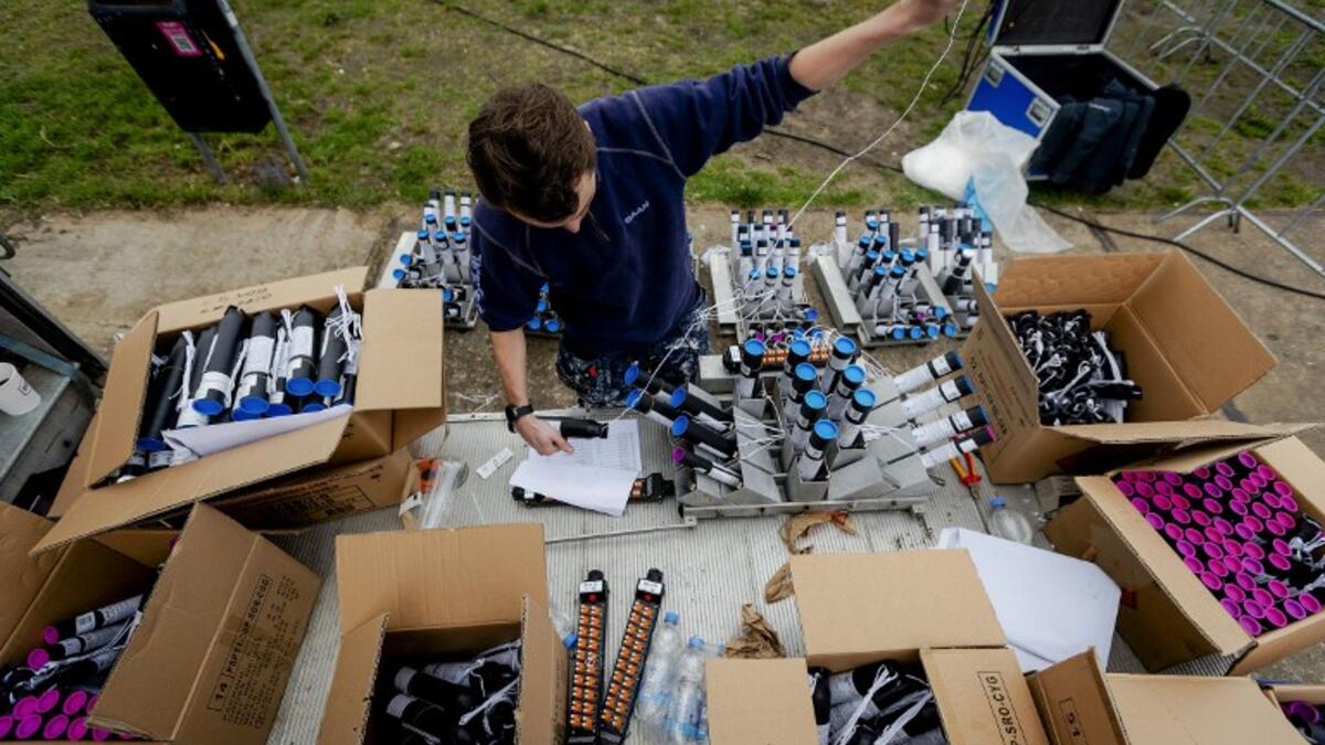 An employee puts the finishing touches on the fireworks show for the New Year in Amsterdam, the Netherlands, on December 30, 2018. The sale of fireworks for the New Year's Eve celebrations started on 28 December, 2018 in the Netherlands.
Robin van Lonkhuijsen / ANP / AFP