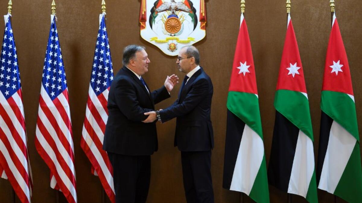 US Secretary of State Mike Pompeo (L) meets with Jordanian Foreign Minister Ayman Safadi in Amman at the start of a Middle East tour to show commitment to the region after the US President's surprise decision to withdraw troops from war-torn Syria on January 8, 2019. 
ANDREW CABALLERO-REYNOLDS / POOL / AFP
